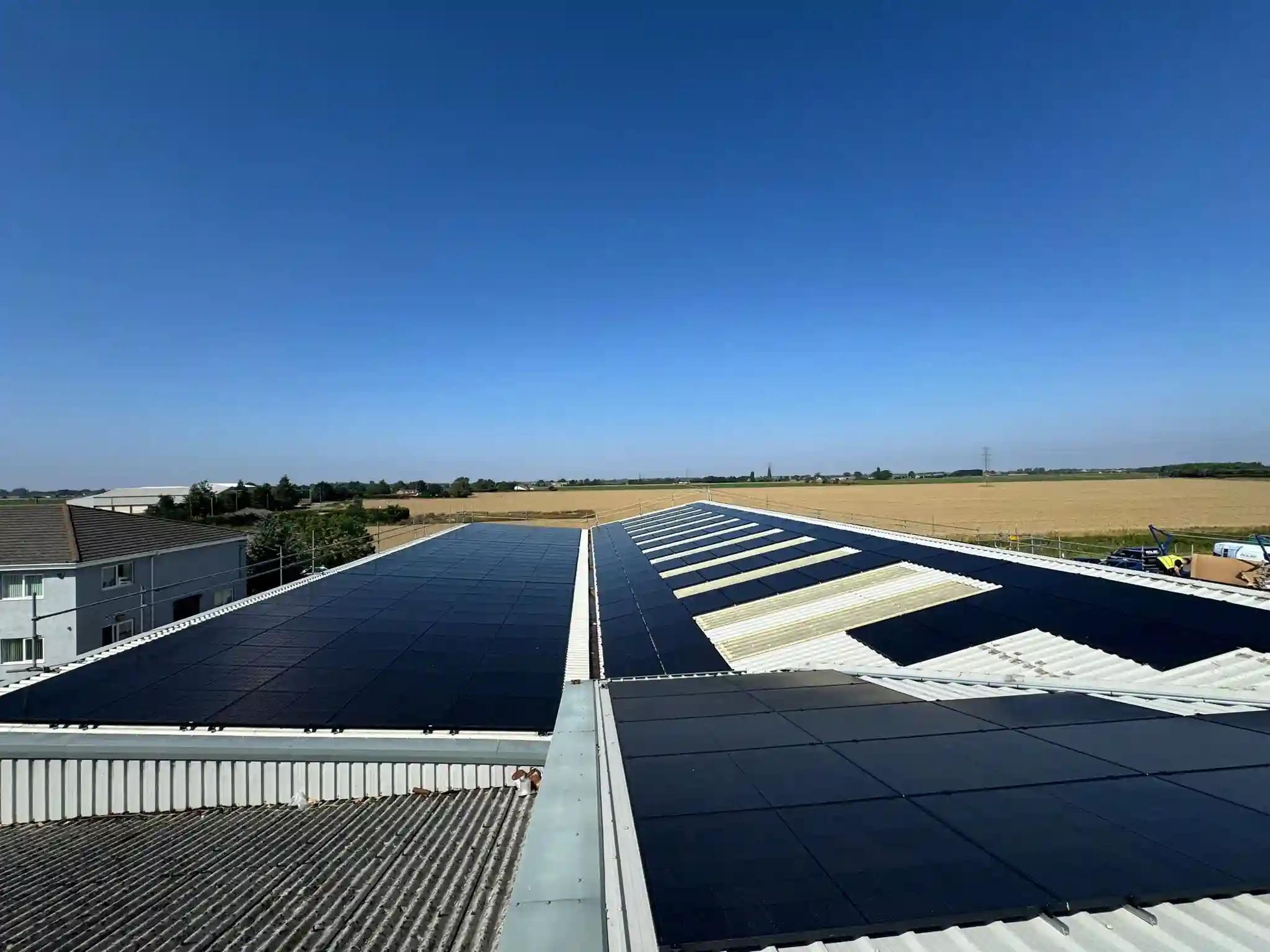 A large flat commercial roof covered in solar panels