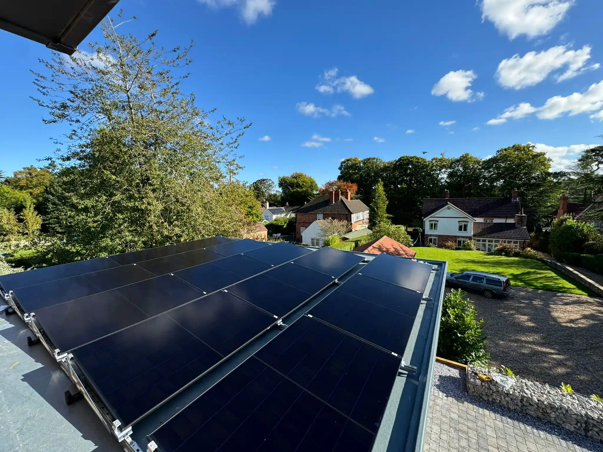 All black solar panels installed on a domestic pitched roof