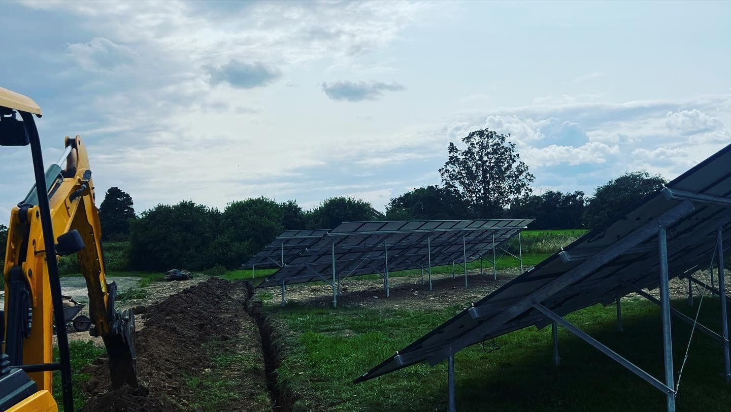 A ground mounted solar array under construction in a Lincolnshire field