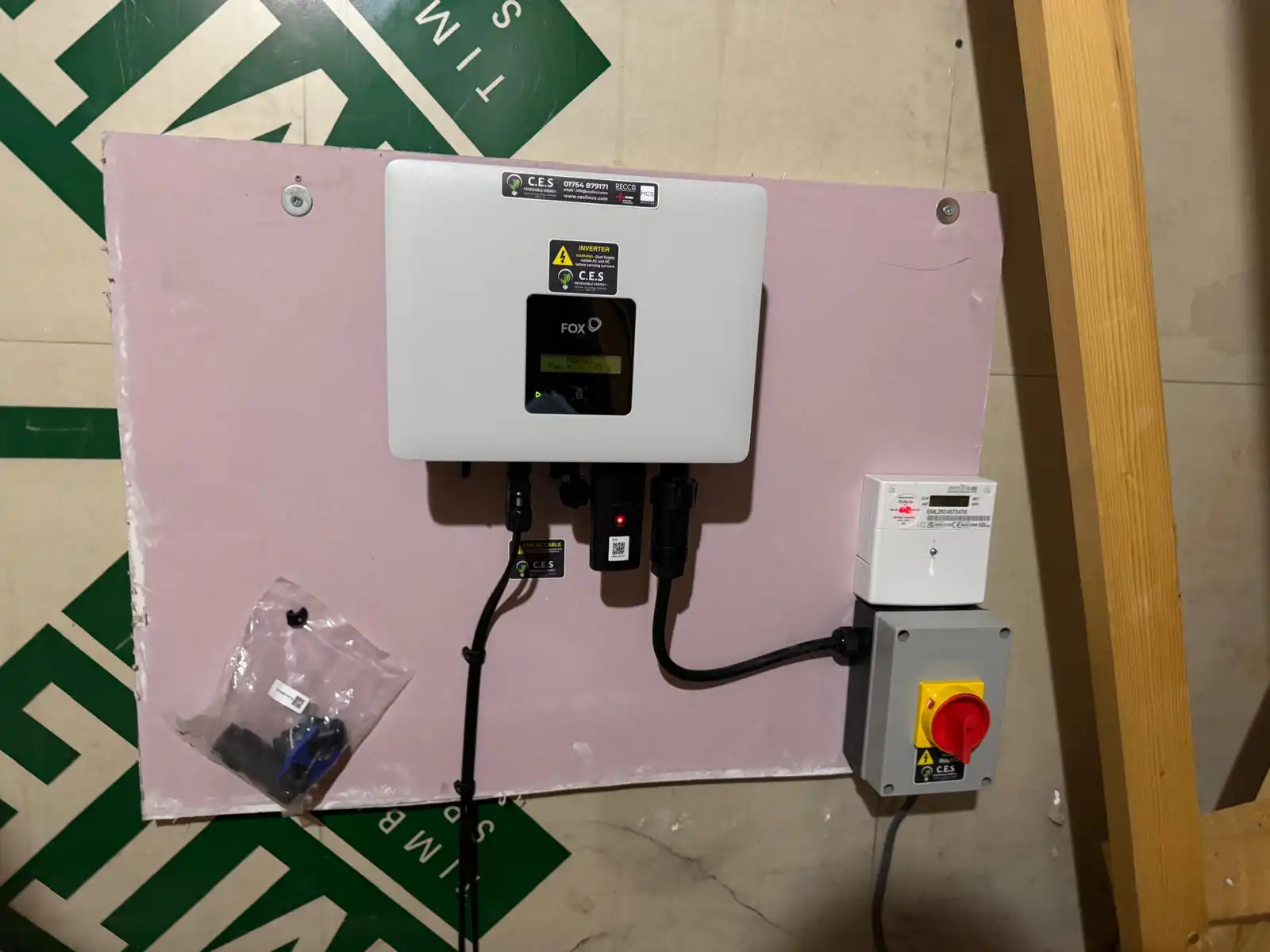 A solar inverter and isolator installed on a wall
