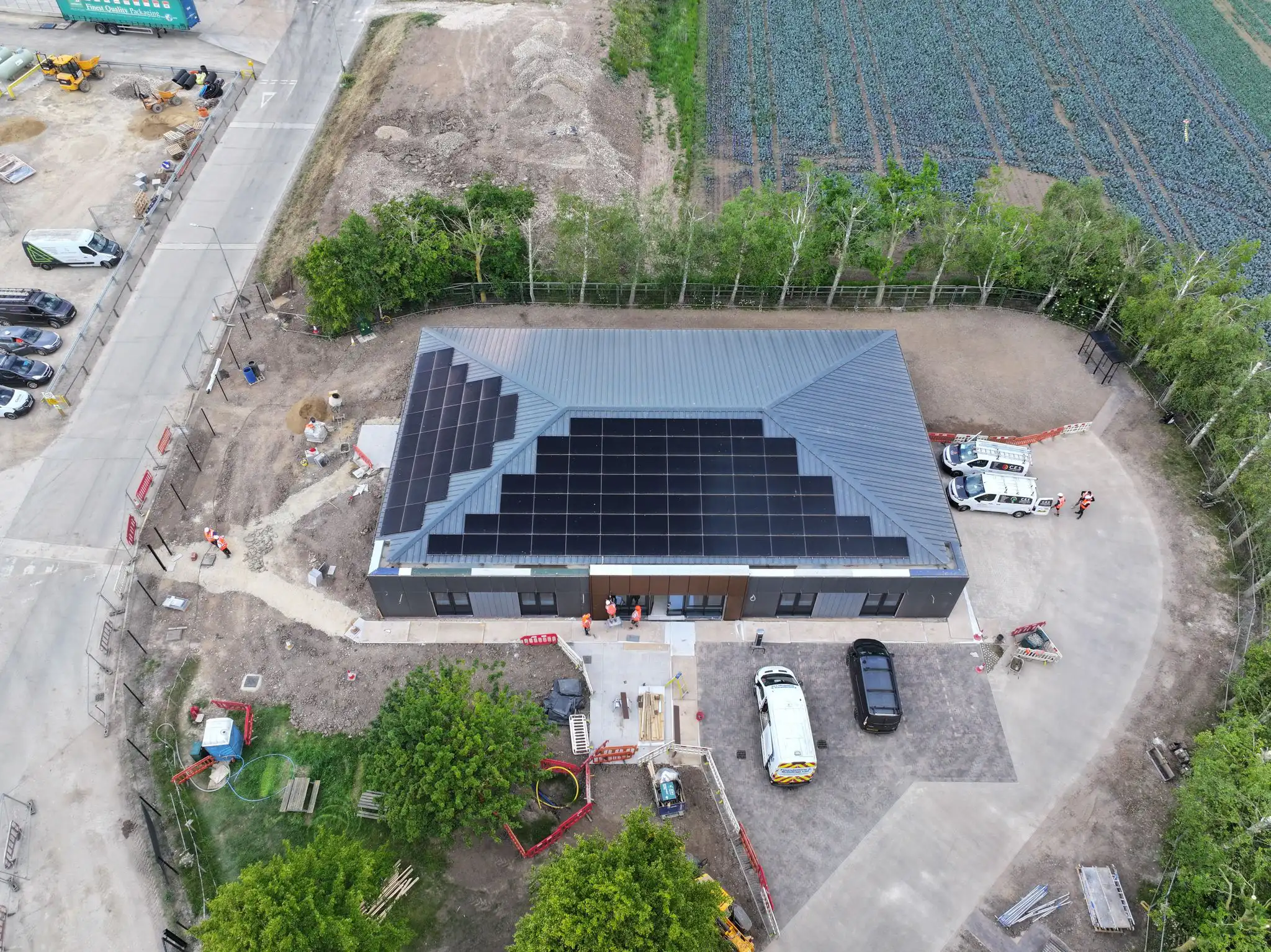 A building with a newly completed full roof solar array
